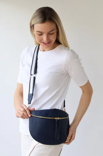 Model wearing Navy Cross Body Zip Detail Bag By Archer House Available at Beetees Nelson